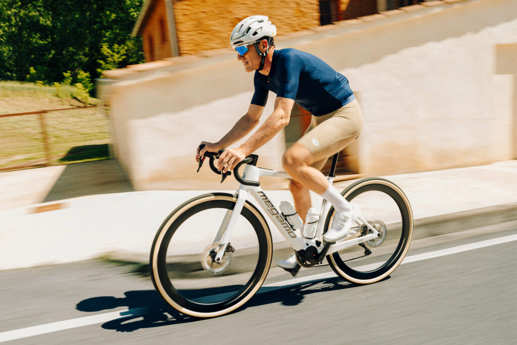 2026 Megamo Upon electric road bike rider in action on trail