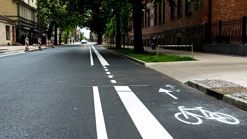 Bicycle congestion on a busy urban street illustrating city traffic challenges from Strong Towns